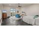 Spacious bedroom with a fireplace, dark hardwood floors, and a walkout to a covered deck with great views at 11881 County Road 37, Fort Lupton, CO 80621