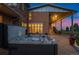 Relax in this outdoor hot tub with a view of the adjacent covered dining area at 11881 County Road 37, Fort Lupton, CO 80621