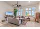 Bright living room with large windows, comfortable sofas, and modern decor at 11881 County Road 37, Fort Lupton, CO 80621