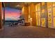 Outdoor patio with a brick floor, featuring an outdoor fireplace and ample seating area at 11881 County Road 37, Fort Lupton, CO 80621