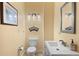 Stylish powder room boasts modern fixtures, elegant decor, and a clean, minimalist design at 11881 County Road 37, Fort Lupton, CO 80621