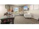 Recreation room featuring an arcade game, guitars, and a cozy seating area at 11881 County Road 37, Fort Lupton, CO 80621