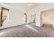 Bright primary bedroom featuring carpet floors, ample natural light, and closet at 371 Granby Way # C, Aurora, CO 80011