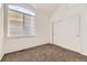 Bedroom with carpeted floor, vaulted ceiling, and slider-door closet at 371 Granby Way # C, Aurora, CO 80011