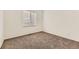Neutral bedroom with carpet and window providing natural light at 371 Granby Way # C, Aurora, CO 80011