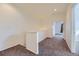 Upstairs hallway with plush carpet and doorways leading to rooms at 371 Granby Way # C, Aurora, CO 80011