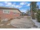 Backyard featuring a stone patio and landscaping at 6630 E Virginia Ave, Denver, CO 80224