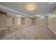 Spacious finished basement with neutral paint, lighting, and carpet at 6630 E Virginia Ave, Denver, CO 80224