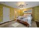 Bright bedroom with floral wallpaper, a comfortable bed, and natural light from the window at 6630 E Virginia Ave, Denver, CO 80224