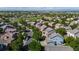An aerial view of a charming neighborhood with tree-lined streets and well-maintained homes at 11861 Fairplay St, Commerce City, CO 80603