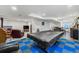 Finished basement featuring a pool table covered, plus additional seating at 11861 Fairplay St, Commerce City, CO 80603