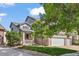 Charming two-story home with a well-maintained lawn and a three car garage at 11861 Fairplay St, Commerce City, CO 80603