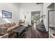 Inviting living room with hardwood floors and an open layout to the kitchen at 11861 Fairplay St, Commerce City, CO 80603