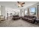 Spacious living area connected to the kitchen with comfortable seating and natural light at 11861 Fairplay St, Commerce City, CO 80603