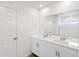 Bright bathroom with double vanity, large mirror, and shower at 546 Red Rock Pl, Brighton, CO 80601