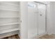 New bathroom showcasing tiled shower and shelving at 546 Red Rock Pl, Brighton, CO 80601