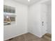 Comfortable bedroom featuring neutral carpeting, a bright window, and a convenient interior door at 546 Red Rock Pl, Brighton, CO 80601