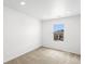 Bedroom features neutral carpet and window with neighborhood view at 546 Red Rock Pl, Brighton, CO 80601
