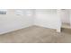 Bright bedroom with neutral carpet and ample natural light at 546 Red Rock Pl, Brighton, CO 80601