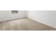 Bedroom with neutral carpet and window view at 546 Red Rock Pl, Brighton, CO 80601
