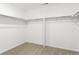Walk-in closet with carpet and closet rods at 546 Red Rock Pl, Brighton, CO 80601