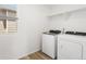 Bright laundry room with washer and dryer at 546 Red Rock Pl, Brighton, CO 80601
