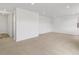Bright and airy living room featuring neutral carpeting and recessed lighting throughout at 546 Red Rock Pl, Brighton, CO 80601