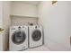 Functional laundry room equipped with a washer and dryer at 11716 W Belleview Dr, Littleton, CO 80127