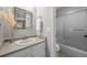 Bathroom with a tub and shower combo features a modern vanity and decorative vase at 9409 W 89Th Cir, Broomfield, CO 80021
