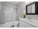 Bathroom with shower-tub includes a sleek vanity and a framed mirror at 9409 W 89Th Cir, Broomfield, CO 80021