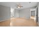 Neutral bedroom boasts a ceiling fan, light wood floors, and bathroom and closet access at 9409 W 89Th Cir, Broomfield, CO 80021