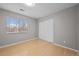 Bedroom boasts a large window, blinds, and light wood floors at 9409 W 89Th Cir, Broomfield, CO 80021