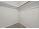 Walk-in closet features wall-mounted shelving and neutral carpet at 9409 W 89Th Cir, Broomfield, CO 80021