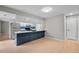 Modern kitchen featuring a breakfast bar, updated appliances, and sleek countertops at 9409 W 89Th Cir, Broomfield, CO 80021