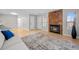 Spacious living room with fireplace, neutral paint, and modern flooring at 9409 W 89Th Cir, Broomfield, CO 80021