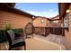 Private outdoor deck featuring lounge seating, privacy fence, and natural surroundings at 9409 W 89Th Cir, Broomfield, CO 80021
