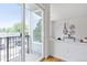 Bright living area features sliding glass doors to a balcony, and is decorated with modern art, creating a stylish and inviting space at 8711 E Hampden Ave # 23, Denver, CO 80231