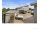 Rooftop deck with lounging and dining furniture, perfect for outdoor entertaining and relaxation at 8711 E Hampden Ave # 23, Denver, CO 80231