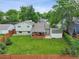 Expansive backyard featuring a wooden deck, lush lawn, shed, and privacy fence for outdoor enjoyment at 9306 Garrison Dr, Broomfield, CO 80021