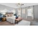 Bright bedroom with a mountain mural and plush rug near large windows at 9306 Garrison Dr, Broomfield, CO 80021