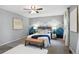 Comfortable bedroom with a king bed, soft carpet, and mountain mural at 9306 Garrison Dr, Broomfield, CO 80021