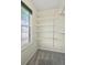 Walk-in closet with adjustable shelving and a window for natural light at 9306 Garrison Dr, Broomfield, CO 80021