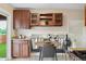 Eat-in kitchen featuring an attached dining nook with plenty of natural light and built-in storage at 9306 Garrison Dr, Broomfield, CO 80021