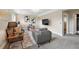 Spacious living room with plush seating, modern lighting, and minimalist decor at 9306 Garrison Dr, Broomfield, CO 80021
