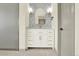 Modern bathroom boasts double sinks, stylish sconces, and plenty of counter space at 12933 E Louisiana Ave, Aurora, CO 80012
