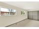 Bedroom featuring neutral carpet and paint, and a closet with sliding doors at 12933 E Louisiana Ave, Aurora, CO 80012