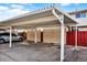 Carport providing covered parking spaces for residents, each with individual storage units and designated parking spots at 12933 E Louisiana Ave, Aurora, CO 80012