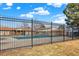 Community pool surrounded by a secure fence, offering residents a place to relax and enjoy the outdoors at 12933 E Louisiana Ave, Aurora, CO 80012