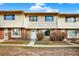 A townhouse-style building with brick accents, offering a welcoming curb appeal with individual unit entrances at 12933 E Louisiana Ave, Aurora, CO 80012