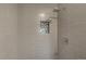 Updated shower featuring gray subway tile and built-in niche with accent mosaic tile at 12933 E Louisiana Ave, Aurora, CO 80012